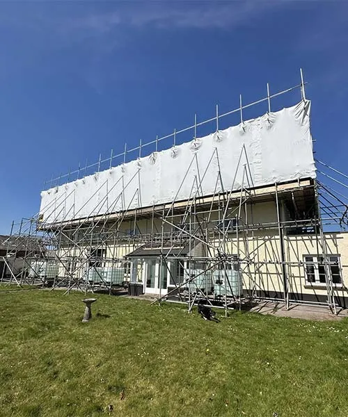 A large house with scaffolding